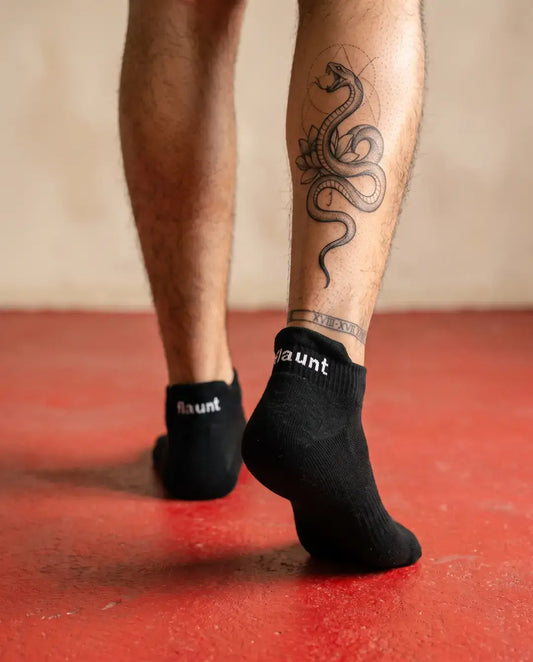 Flaunt Socks worn, walking away, red floor